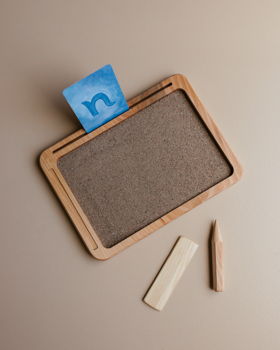Schrijven oefenen zand